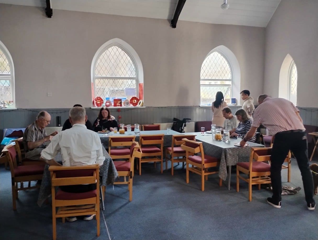 The chapel after a Sunday gathering, with the Disciple slide on screen